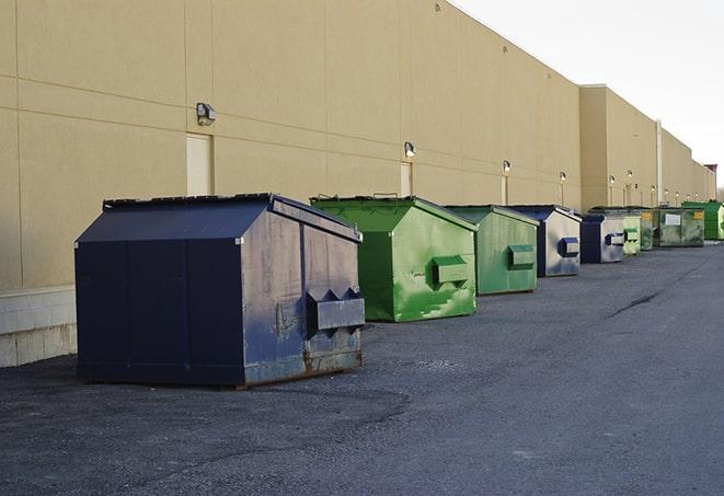 portable, green construction dumpsters serving as a container for scrap materials in Campbell, TX